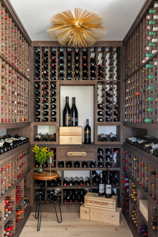 Example of a beach style wine cellar design in San Diego