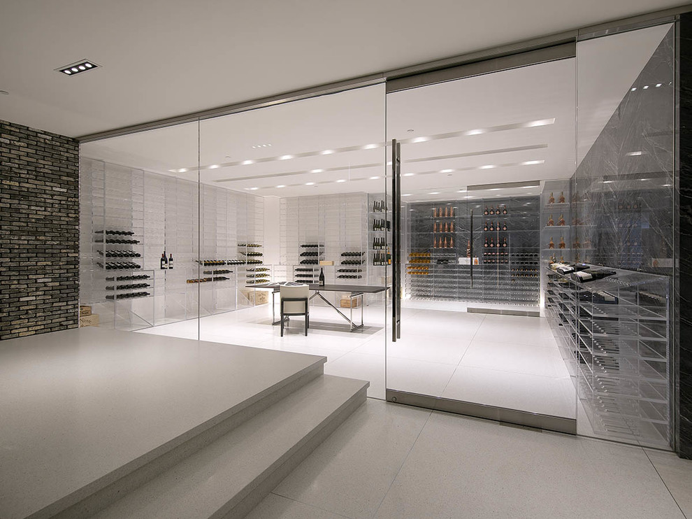 Inspiration for an expansive contemporary wine cellar in Los Angeles with marble floors, storage racks and white floor.