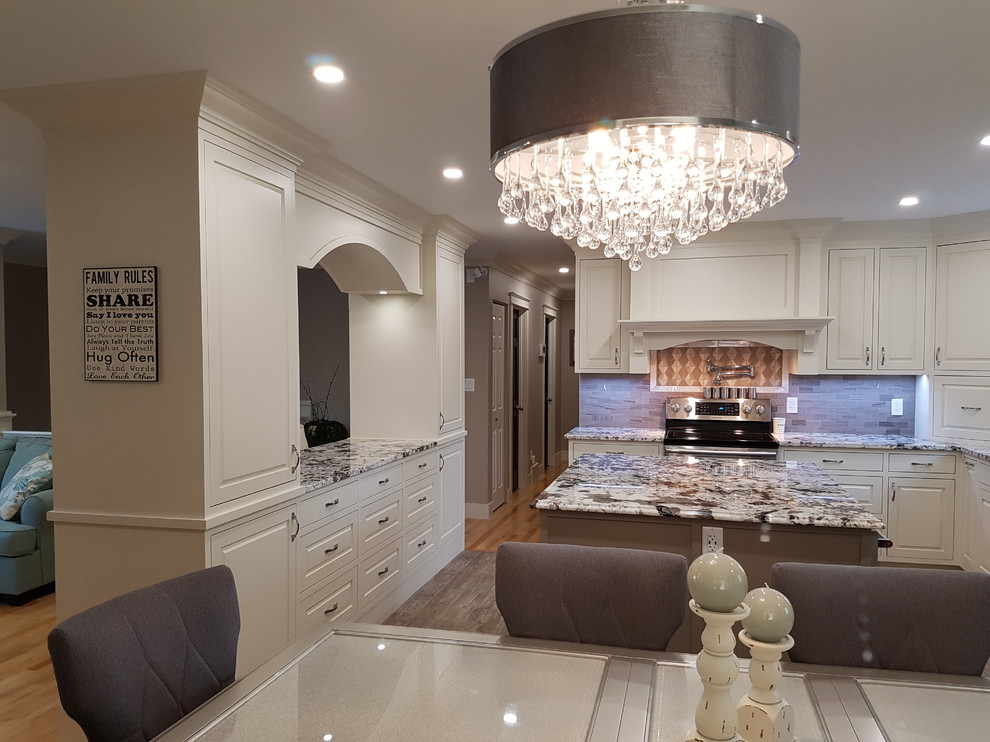 Inspiration for a mid-sized transitional u-shaped vinyl floor and gray floor eat-in kitchen remodel in Calgary with an undermount sink, beaded inset cabinets, white cabinets, granite countertops, gray backsplash, stainless steel appliances, two islands, gray countertops and ceramic backsplash