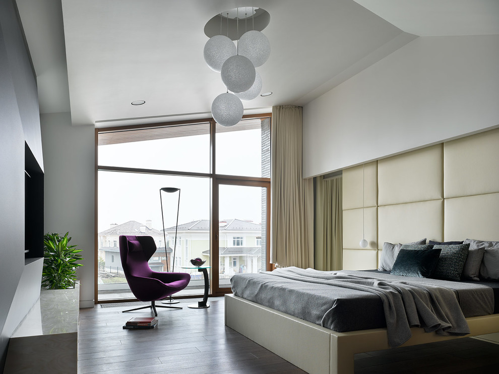 Contemporary master bedroom in Moscow with white walls, dark hardwood floors and brown floor.
