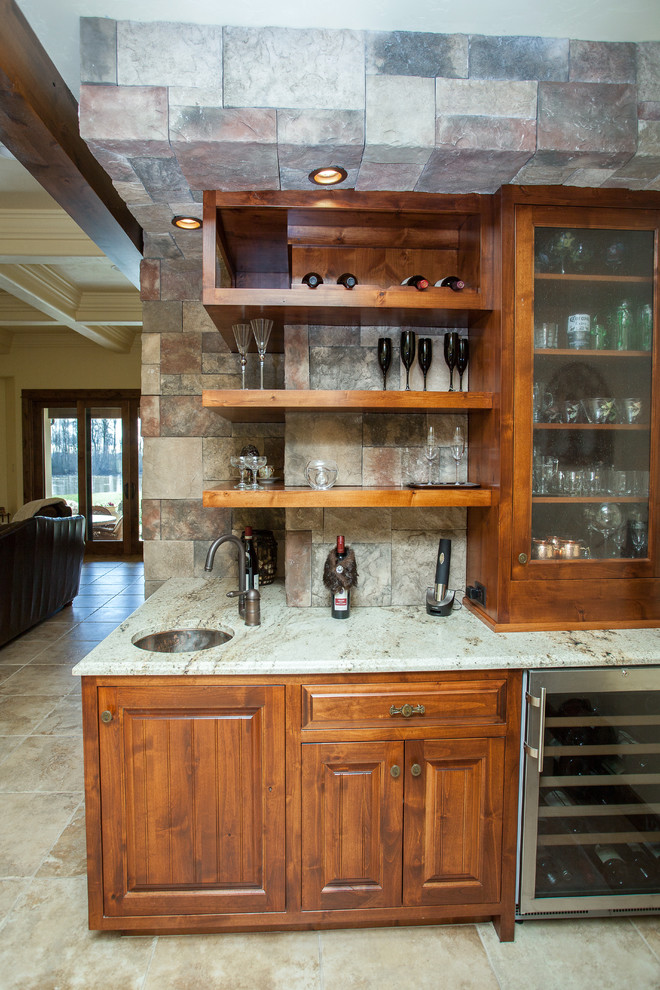 This is an example of a small arts and crafts single-wall wet bar in Portland with an undermount sink, shaker cabinets, medium wood cabinets, ceramic floors, beige floor and white benchtop.