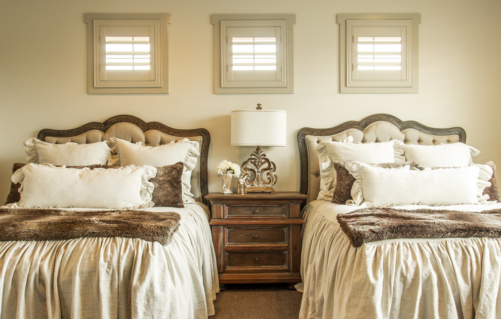 Design ideas for a traditional guest bedroom in Austin with beige walls.