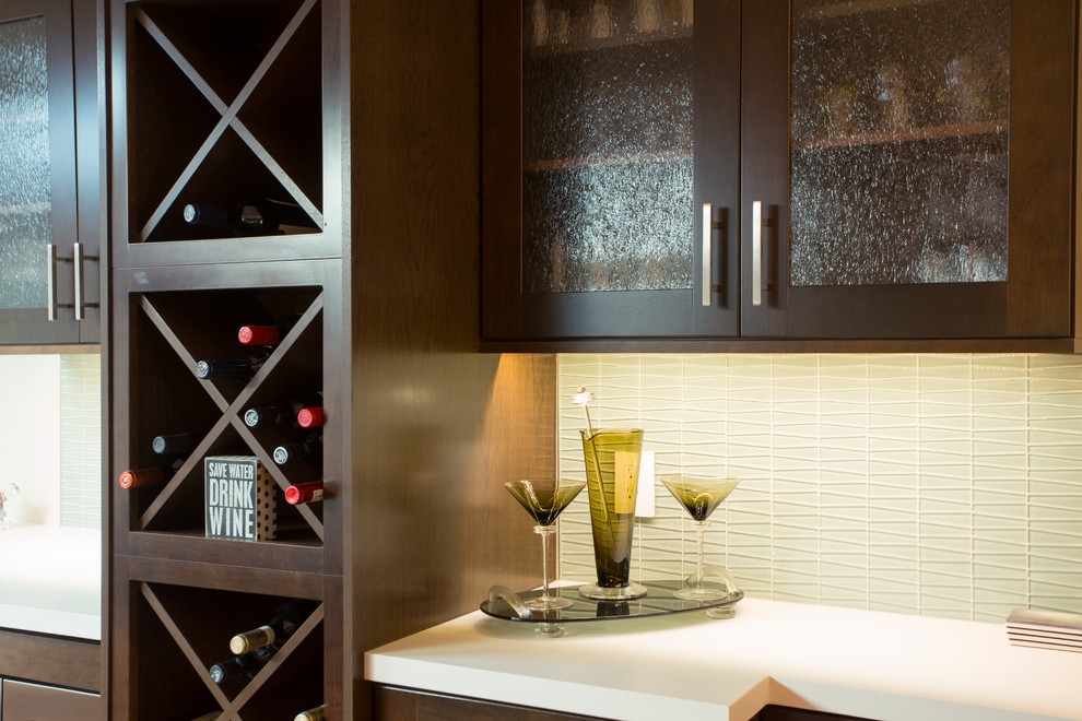 Example of a small transitional u-shaped terra-cotta tile eat-in kitchen design in Miami with an undermount sink, shaker cabinets, dark wood cabinets, quartz countertops, green backsplash, glass tile backsplash and stainless steel appliances
