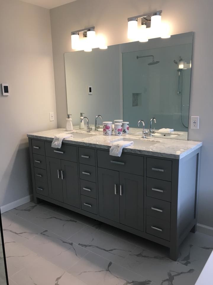 This is an example of a mid-sized transitional master bathroom in Other with a freestanding tub, grey walls, an undermount sink, grey floor, recessed-panel cabinets, grey cabinets, a corner shower, quartzite benchtops and white benchtops.
