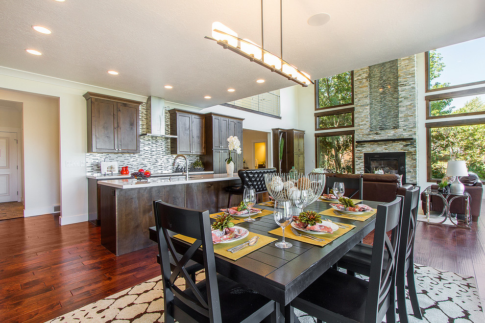Design ideas for a large contemporary open plan dining in Salt Lake City with white walls, dark hardwood floors and brown floor.