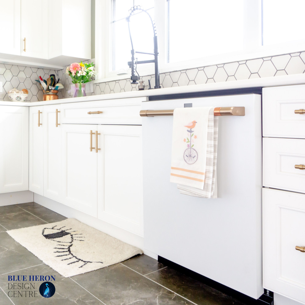 Mid-sized transitional u-shaped laminate floor and gray floor eat-in kitchen photo with an undermount sink, shaker cabinets, white cabinets, quartz countertops, gray backsplash, ceramic backsplash, white appliances, no island and white countertops