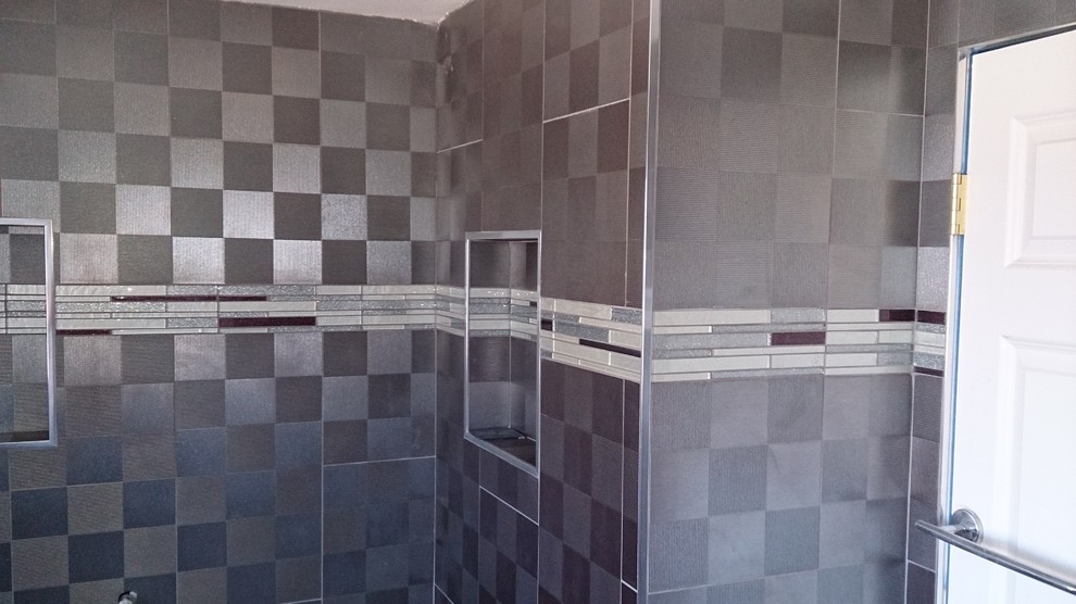 This is an example of a small contemporary master bathroom in Orange County with flat-panel cabinets, an open shower, a two-piece toilet, multi-coloured tile, metal tile, porcelain floors, an undermount sink, white floor and a shower curtain.