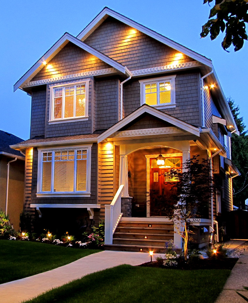 Mid-sized traditional two-storey exterior in Vancouver with wood siding.