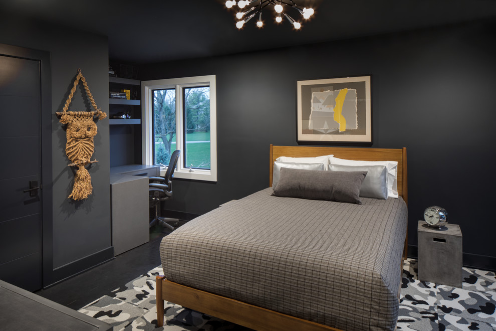 This is an example of a mid-sized transitional bedroom in Indianapolis with black walls, dark hardwood floors, no fireplace and black floor.