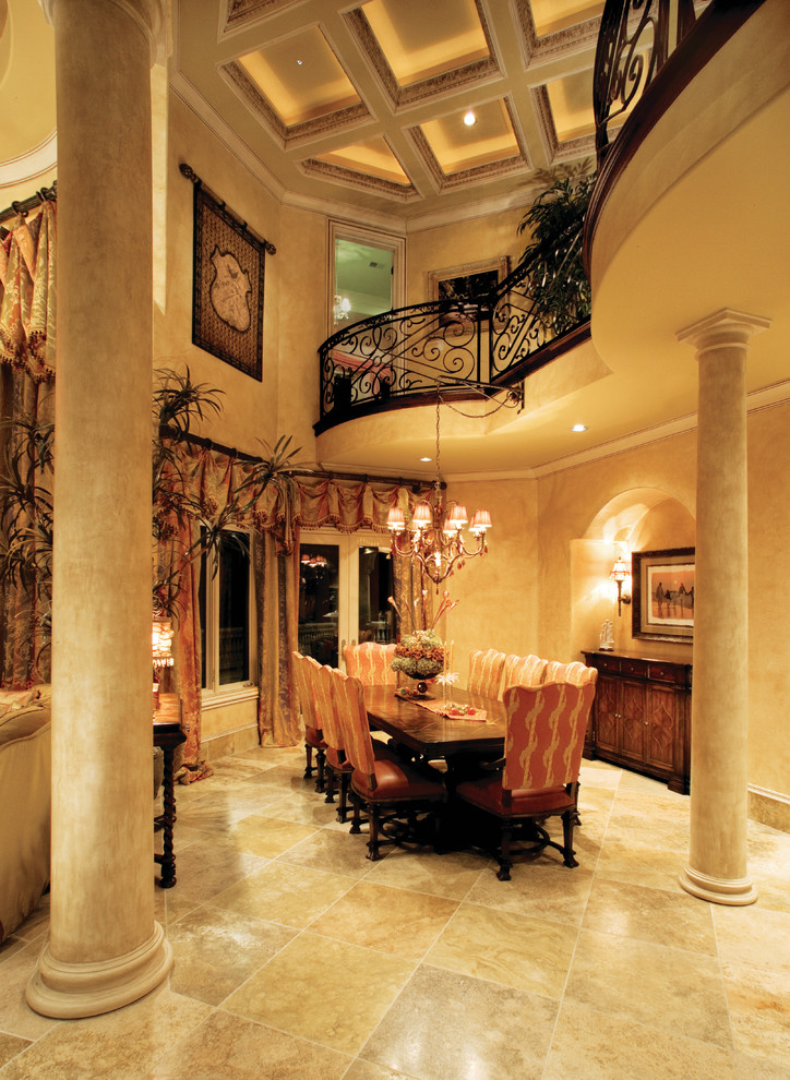Expansive mediterranean separate dining room in Miami with beige walls, travertine floors and no fireplace.