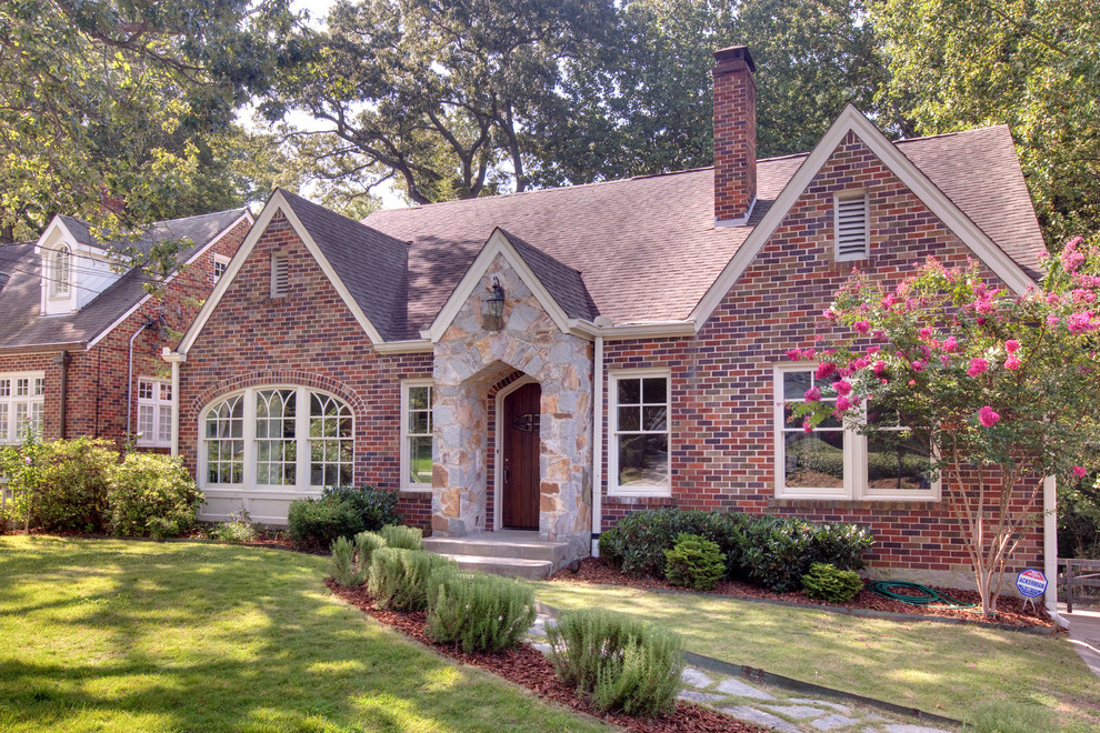 This is an example of a mid-sized traditional two-storey brick exterior in Atlanta.