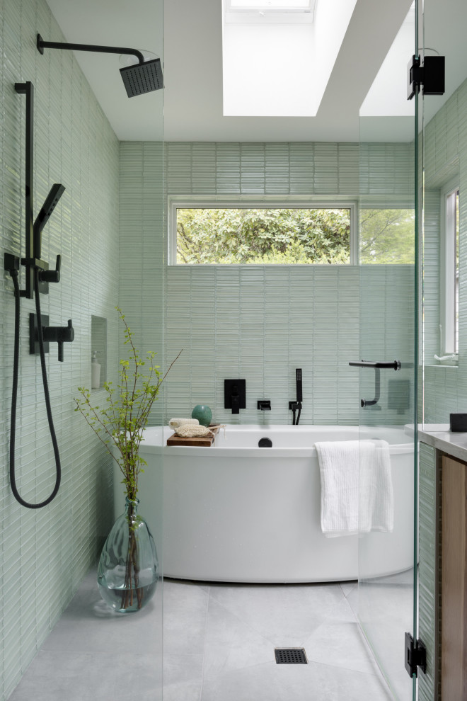 Inspiration for a small modern master wet room bathroom in Seattle with flat-panel cabinets, light wood cabinets, a freestanding tub, a bidet, green tile, glass tile, white walls, cement tiles, a vessel sink, quartzite benchtops, grey floor, a hinged shower door, white benchtops, an enclosed toilet, a double vanity, a built-in vanity and vaulted.