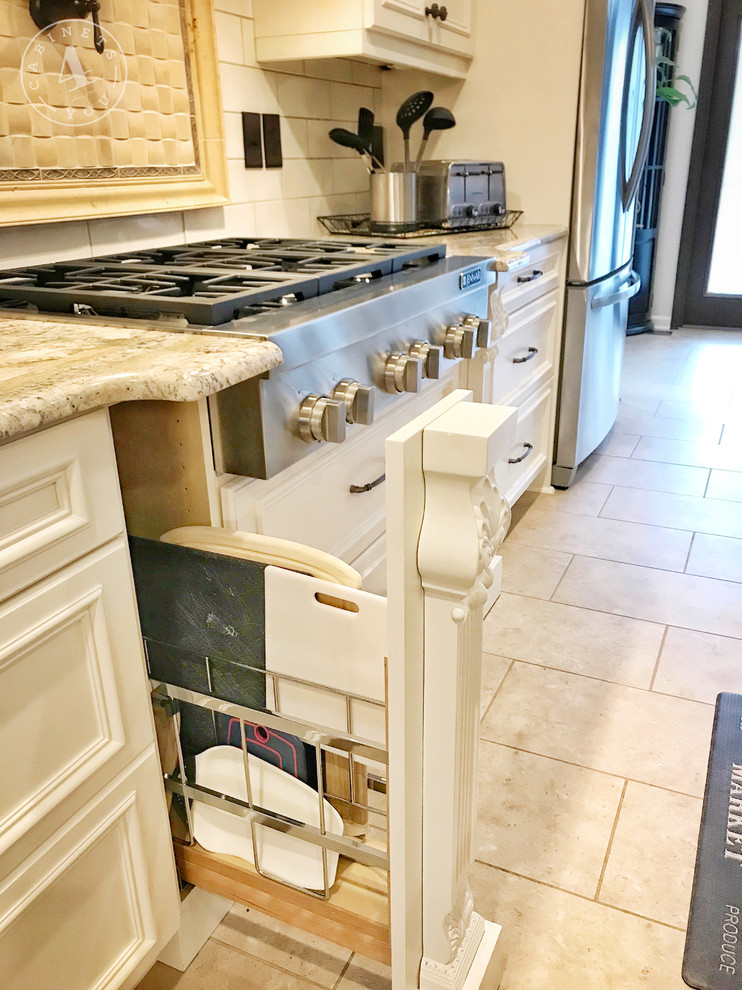 Mid-sized traditional l-shaped eat-in kitchen in Atlanta with a farmhouse sink, recessed-panel cabinets, white cabinets, granite benchtops, white splashback, ceramic splashback, stainless steel appliances, ceramic floors, with island, beige floor and grey benchtop.