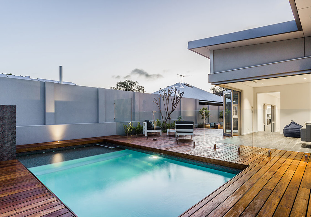 Design ideas for a small contemporary backyard rectangular pool in Perth with decking.