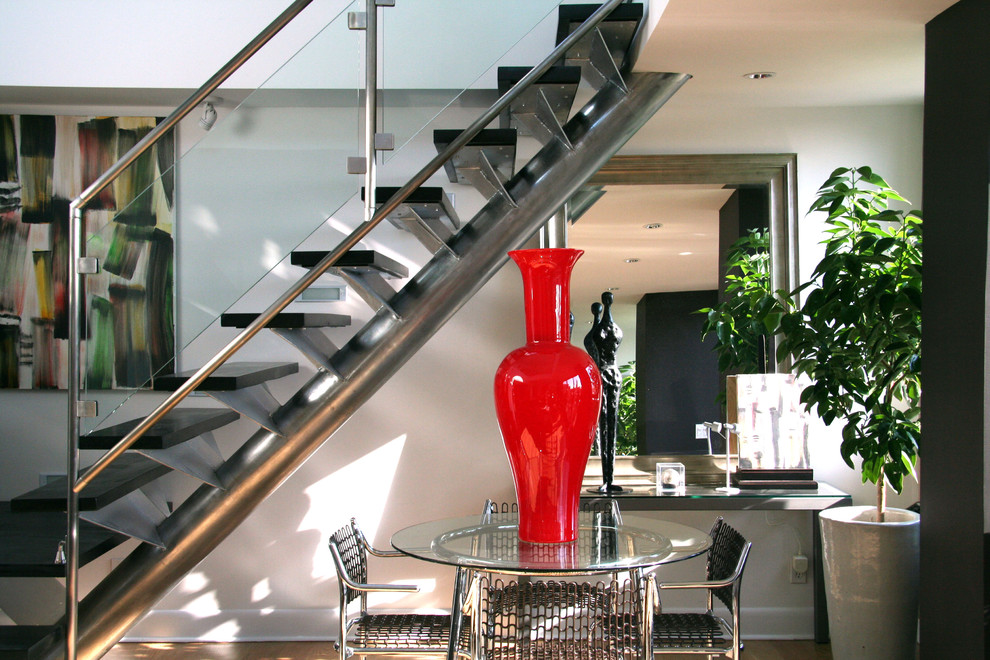 Inspiration for a large modern painted wood floating staircase in New York with open risers.