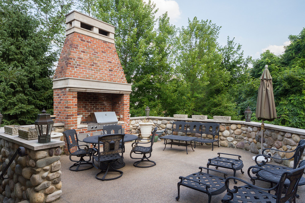 Inspiration for a large traditional backyard patio in Other with with fireplace, decomposed granite and no cover.