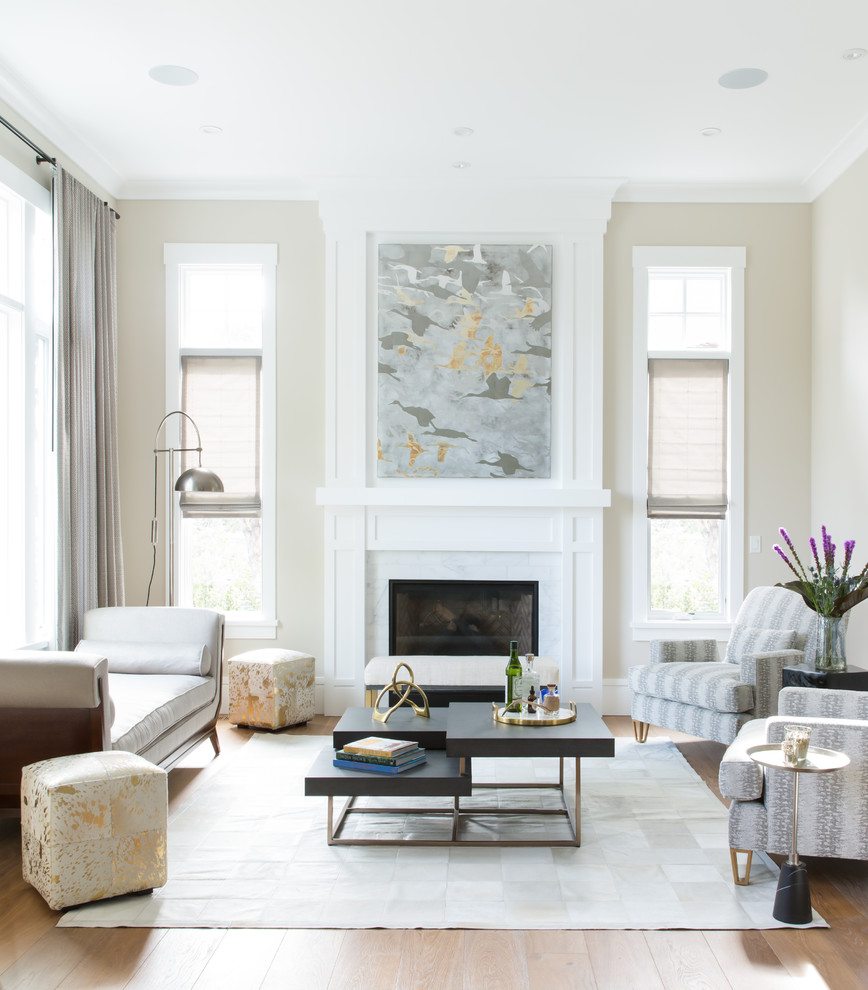 Example of a large transitional formal and open concept medium tone wood floor and beige floor living room design in San Francisco with beige walls, no tv, a standard fireplace and a stone fireplace