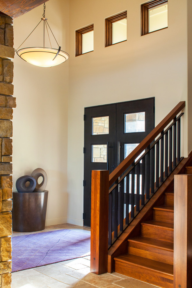 Inspiration for a transitional entryway in Austin with beige walls and a double front door.