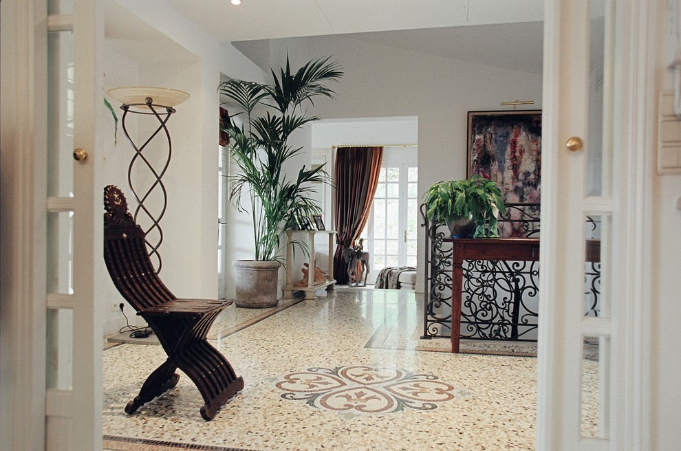 Inspiration for a mid-sized traditional entryway in Venice with white walls, terrazzo floors and multi-coloured floor.