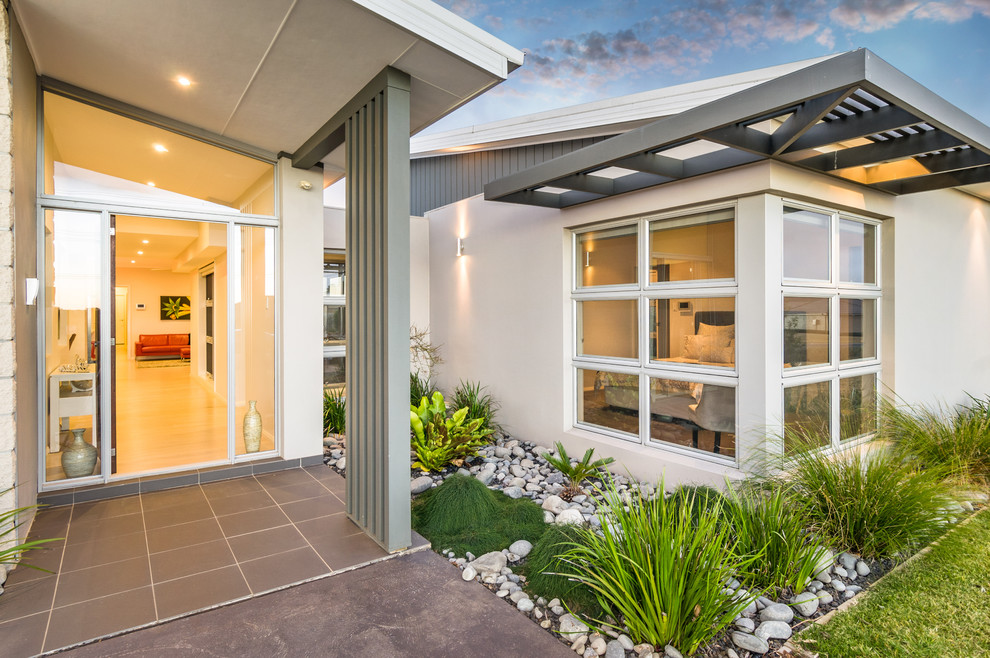 Mid-sized modern front door in Sydney with white walls, bamboo floors, a single front door and a medium wood front door.