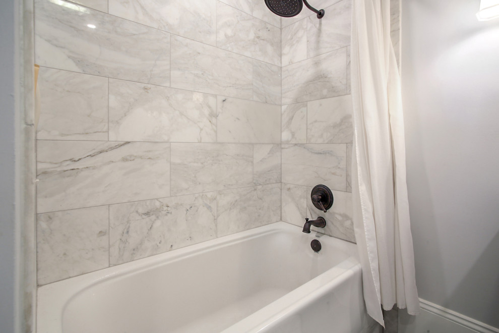 Inspiration for a small traditional master bathroom in New Orleans with shaker cabinets, grey cabinets, an alcove tub, a shower/bathtub combo, white tile, metal tile, white walls, marble floors, an undermount sink, marble benchtops, white floor, a shower curtain and white benchtops.
