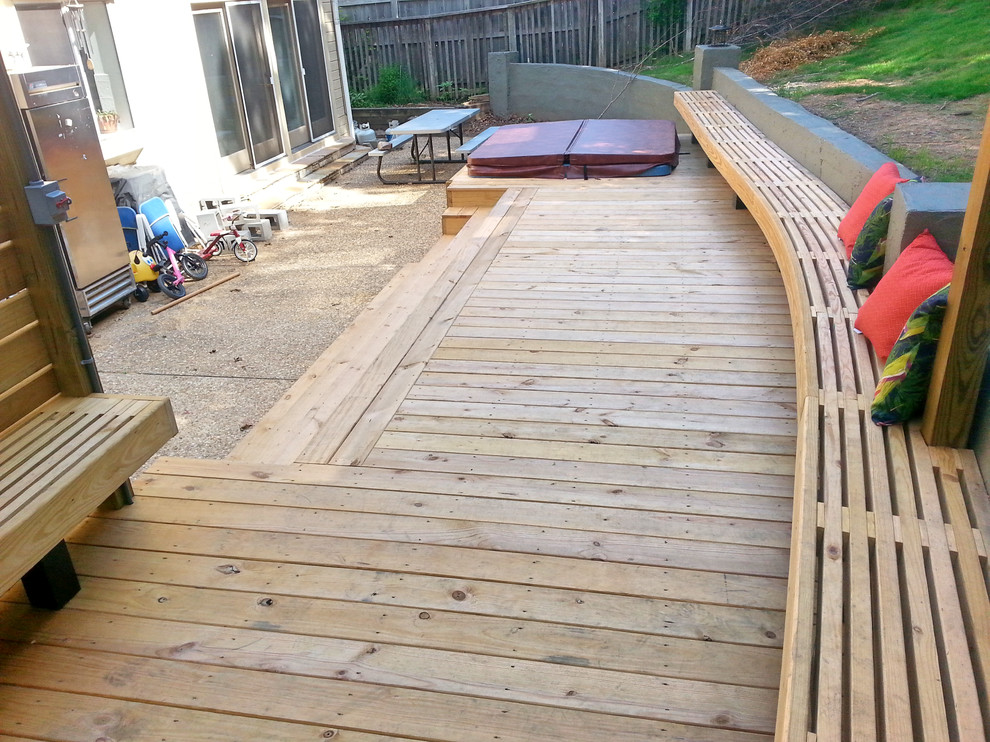 Inspiration for a large backyard deck remodel with a pergola