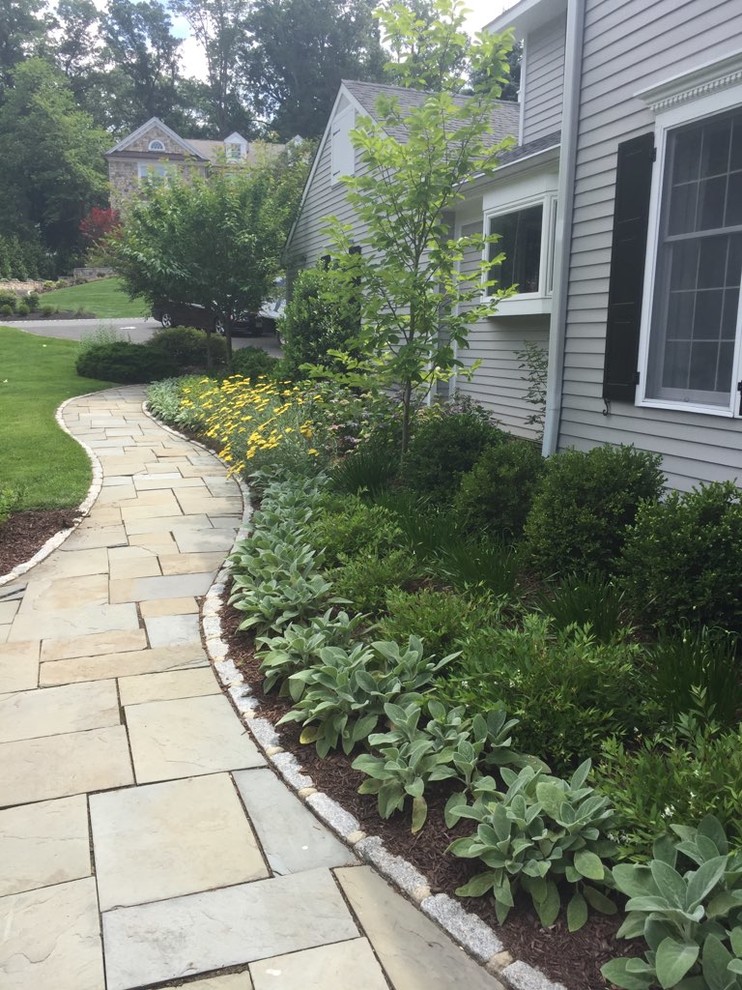 Mid-sized traditional side yard full sun garden in New York with with path and concrete pavers.