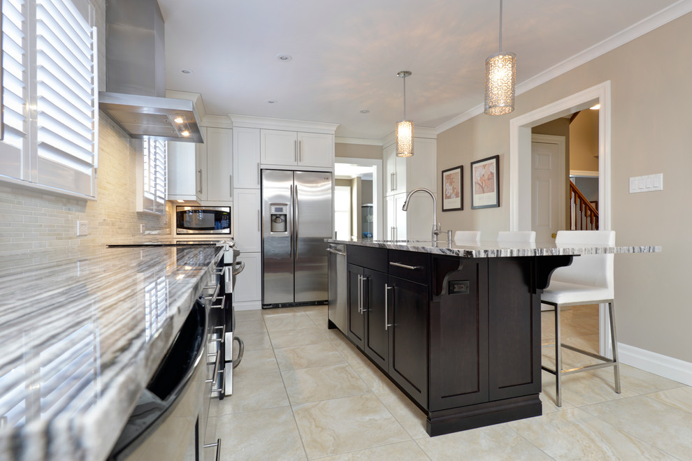 Inspiration for a large transitional u-shaped ceramic tile enclosed kitchen remodel in Toronto with an undermount sink, flat-panel cabinets, dark wood cabinets, granite countertops, beige backsplash, matchstick tile backsplash, stainless steel appliances and an island