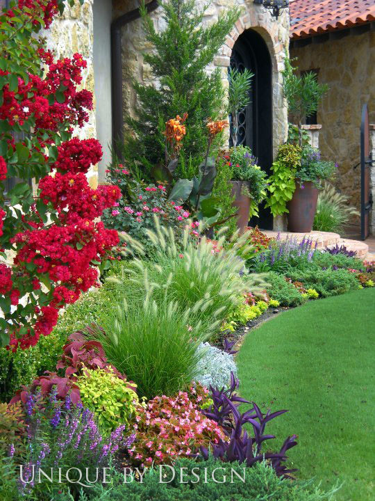 This is an example of a traditional front yard full sun garden for summer in Oklahoma City.