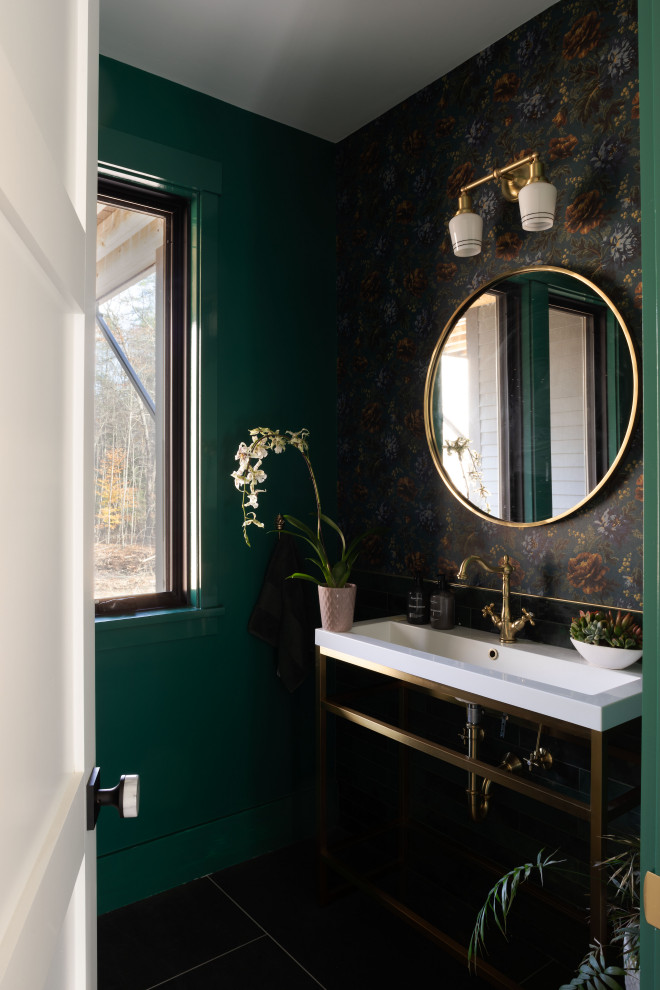 Inspiration for a mid-sized transitional powder room in Boston with green walls, ceramic floors, a console sink, engineered quartz benchtops, black floor, white benchtops, a freestanding vanity and wallpaper.