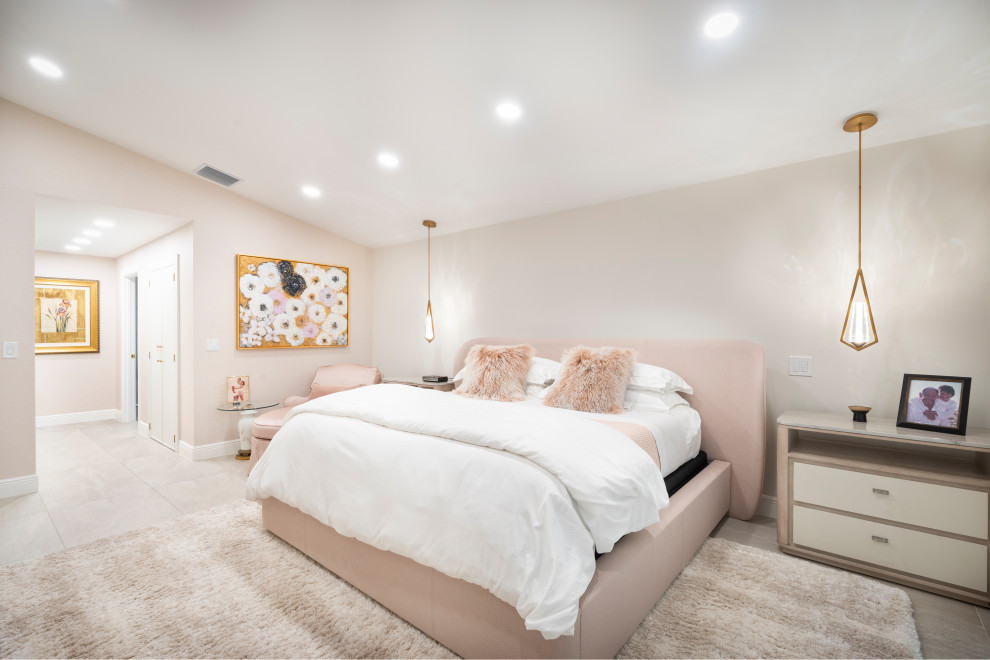 Example of a transitional beige floor and vaulted ceiling bedroom design in Miami with beige walls