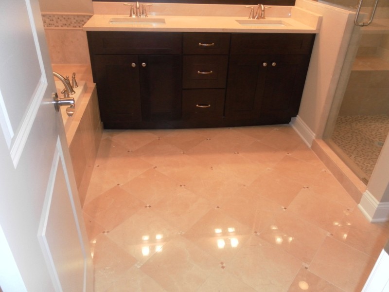 Transitional beige tile and mosaic tile alcove shower photo in Chicago with dark wood cabinets and beige walls