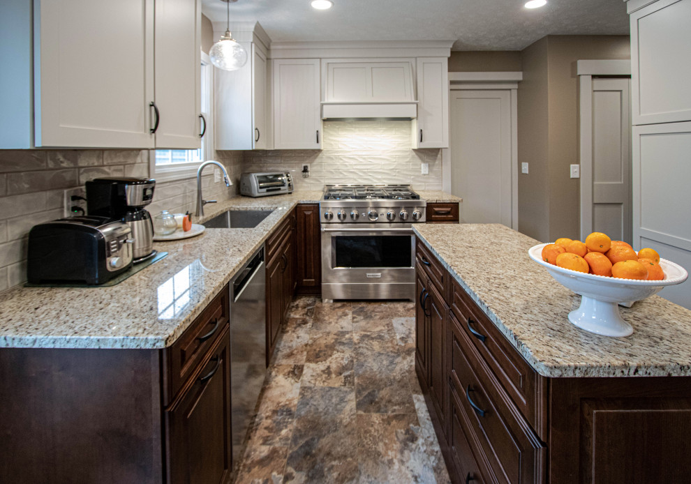 Mid-sized transitional vinyl floor and brown floor eat-in kitchen photo in Cleveland with an undermount sink, raised-panel cabinets, dark wood cabinets, quartz countertops, beige backsplash, ceramic backsplash, stainless steel appliances, an island and beige countertops