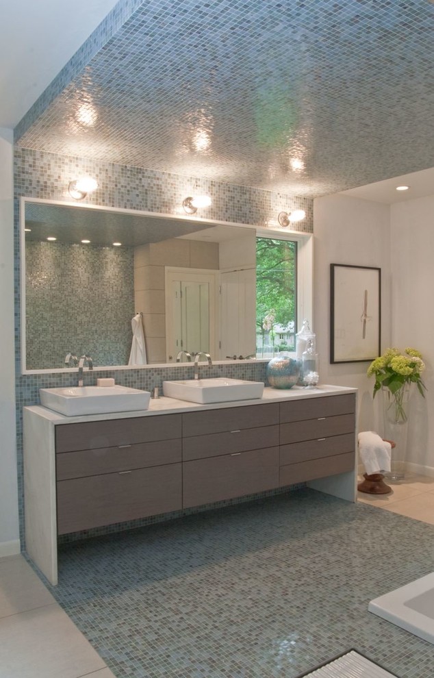 This is an example of a contemporary bathroom in Indianapolis with a vessel sink, flat-panel cabinets, grey cabinets, marble benchtops and blue tile.