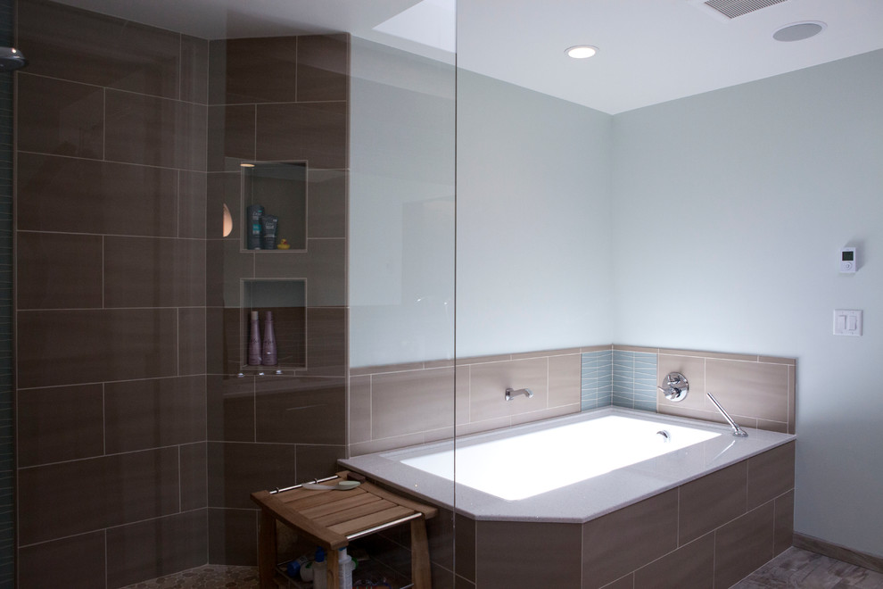 Photo of a large modern bathroom in San Francisco with an undermount sink, flat-panel cabinets, medium wood cabinets, engineered quartz benchtops, an undermount tub, an open shower, a one-piece toilet, multi-coloured tile, ceramic tile, blue walls and ceramic floors.