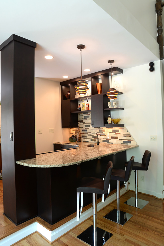 This is an example of a contemporary home bar in Charlotte.