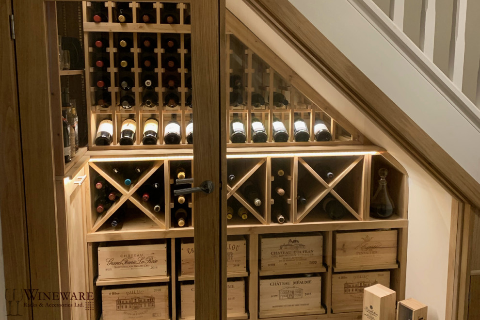 This is an example of a mid-sized contemporary wine cellar in Oxfordshire with grey floor.
