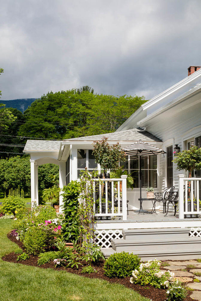 Small cottage chic white two-story wood gable roof photo in Boston with a mixed material roof