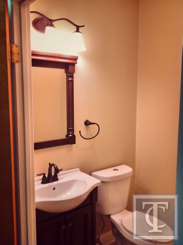 This is an example of a traditional powder room in Baltimore.