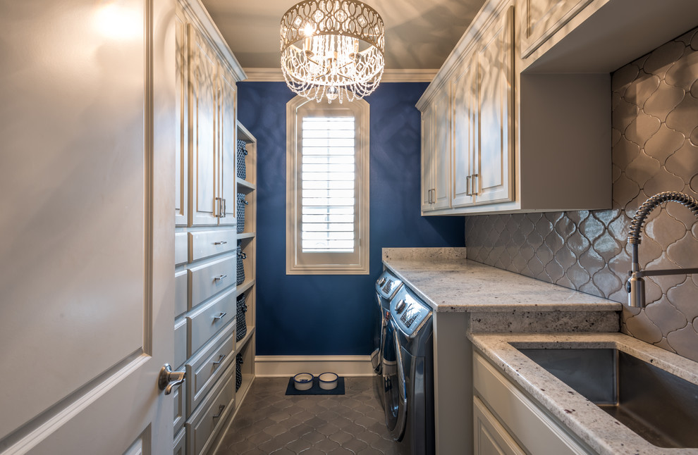 Mid-sized transitional galley dedicated laundry room in Dallas with an undermount sink, raised-panel cabinets, beige cabinets, granite benchtops, blue walls, ceramic floors and a side-by-side washer and dryer.