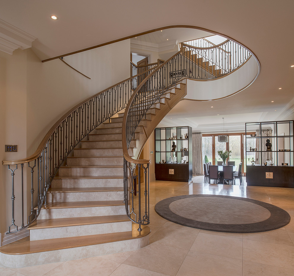 Design ideas for a contemporary wood curved staircase in Hampshire.