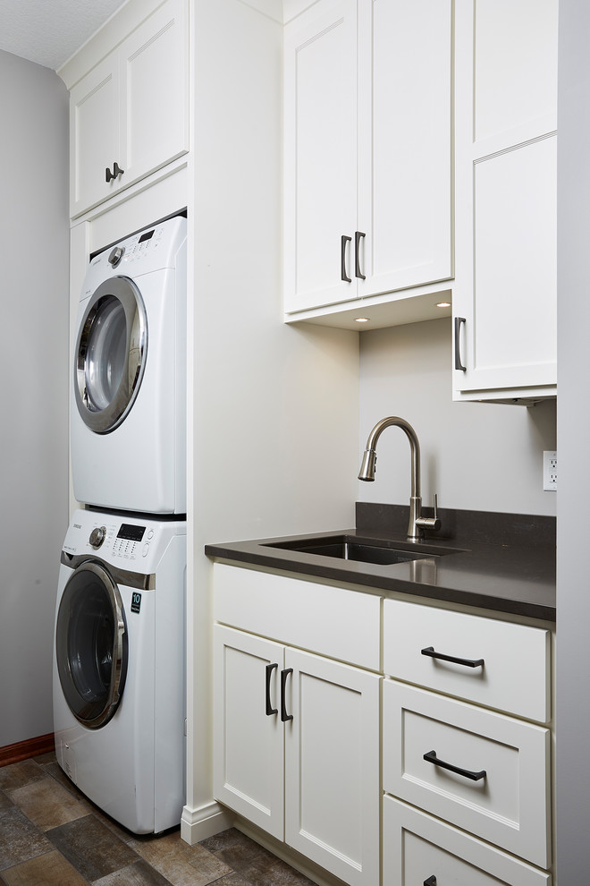 This is an example of a large contemporary laundry room in Minneapolis.