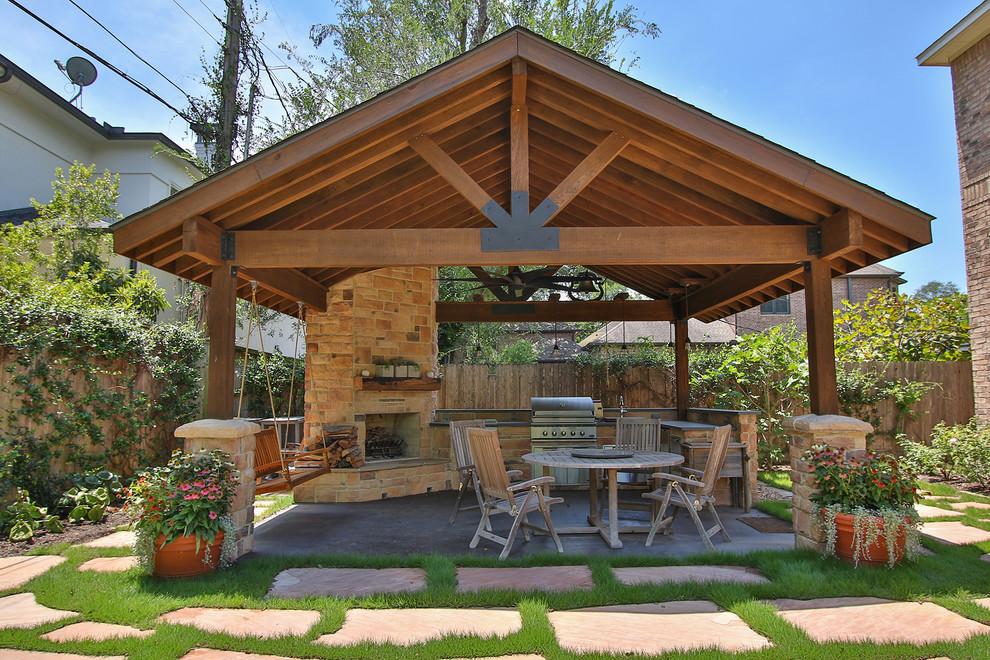 Photo of a large country backyard patio in Houston with an outdoor kitchen, a gazebo/cabana and concrete slab.