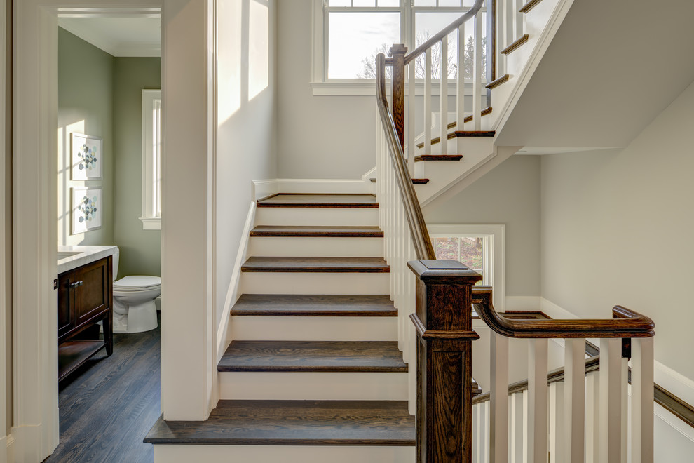Large transitional wooden u-shaped wood railing staircase photo in DC Metro with painted risers