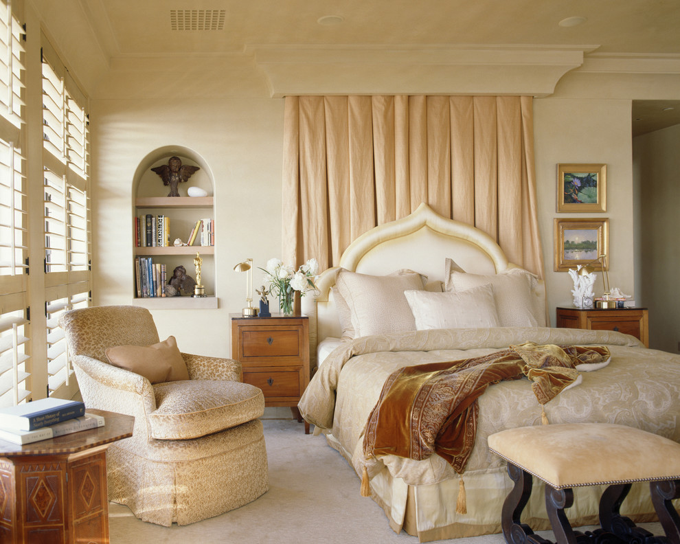 Design ideas for a mediterranean bedroom in San Francisco with beige walls and carpet.