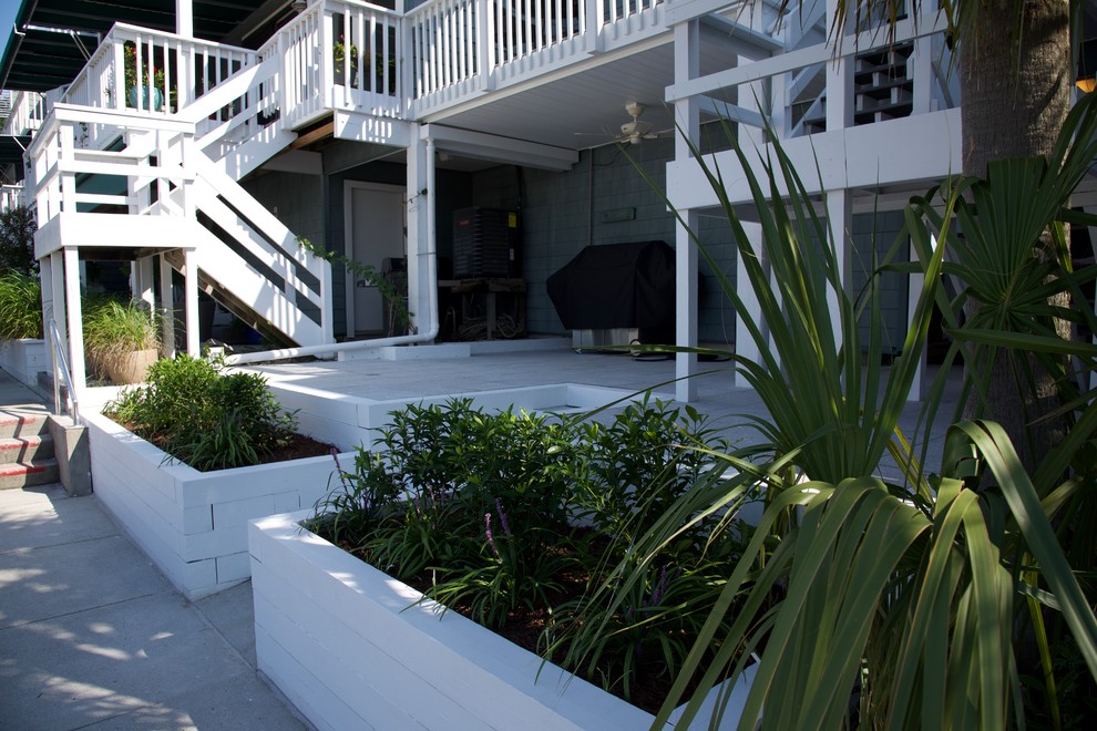 Beach style backyard deck in Wilmington with an outdoor kitchen and no cover.