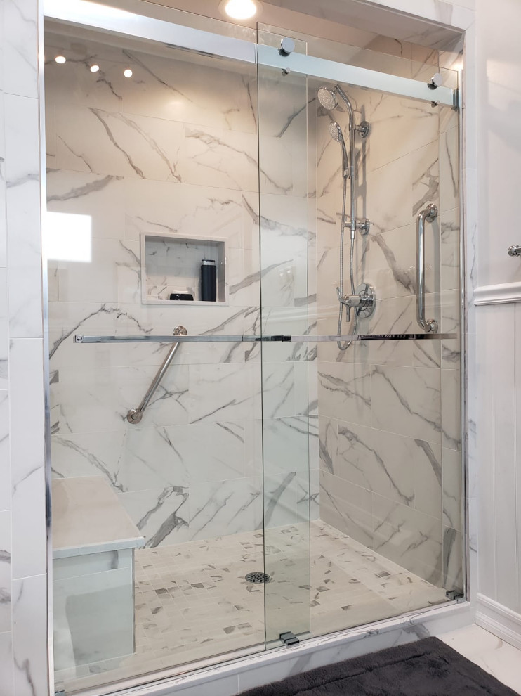 Inspiration for a large modern master bathroom in New York with shaker cabinets, grey cabinets, a drop-in tub, a double shower, a bidet, white tile, porcelain tile, white walls, porcelain floors, an undermount sink, quartzite benchtops, white floor, a sliding shower screen and white benchtops.