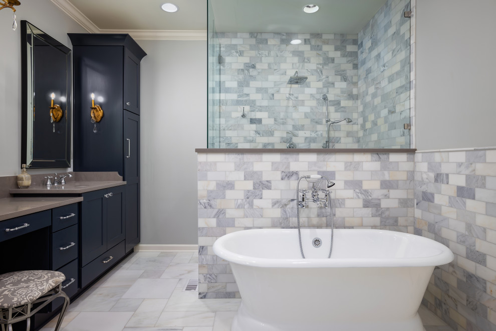 Design ideas for a transitional master bathroom in Birmingham with shaker cabinets, blue cabinets, a freestanding tub, an alcove shower, subway tile, grey walls, an undermount sink, a hinged shower door, beige benchtops, a double vanity and a built-in vanity.