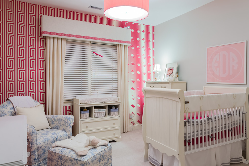 Photo of a transitional nursery for girls in Raleigh with multi-coloured walls and carpet.