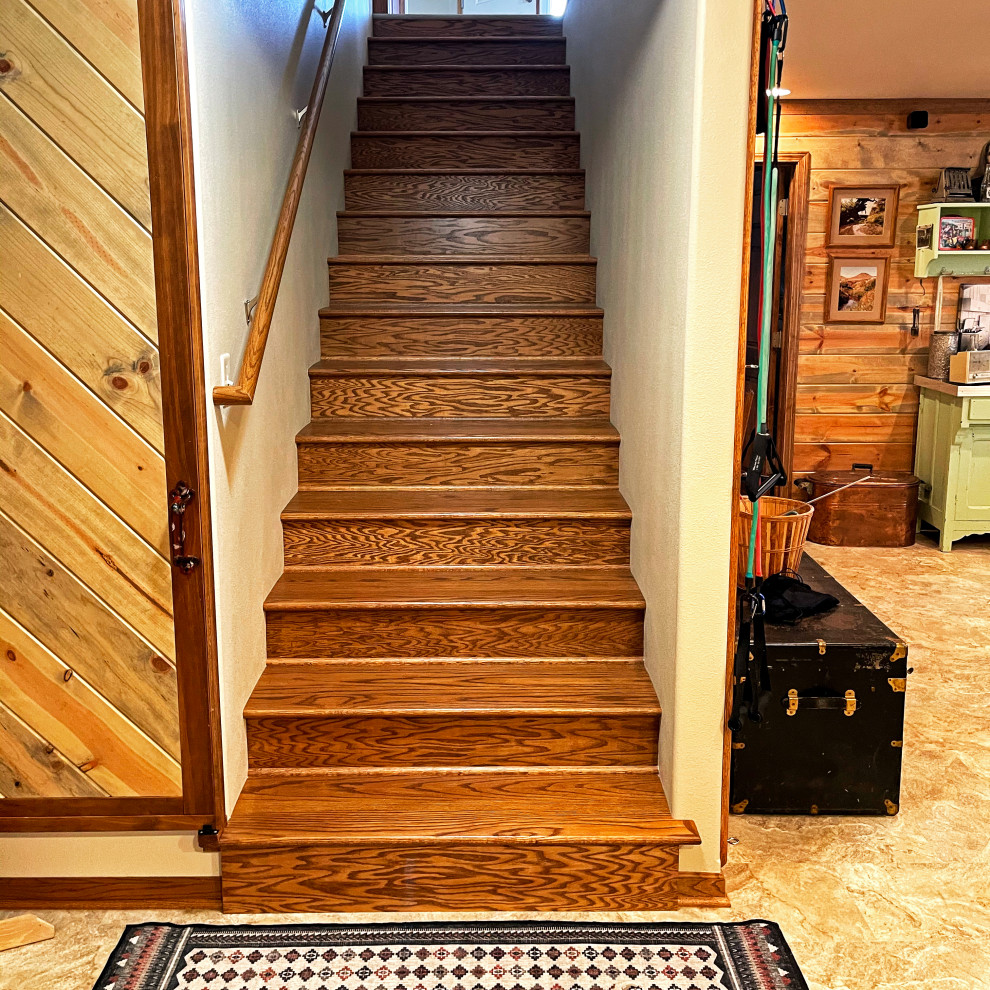 This is an example of a medium sized rustic wood straight wood railing staircase in Other with wood risers.